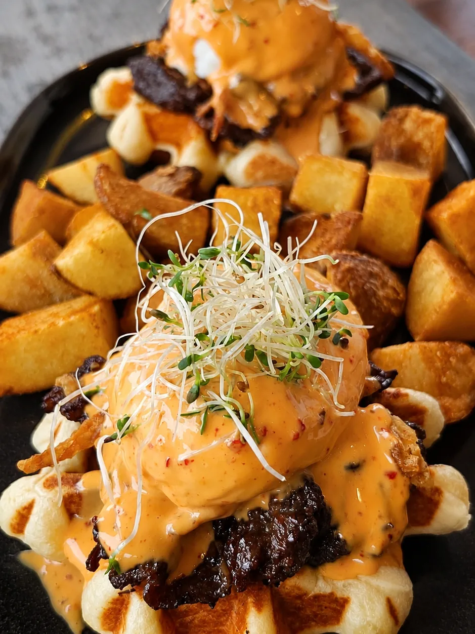 KBBQ eggs benedict served on waffles with potatoes